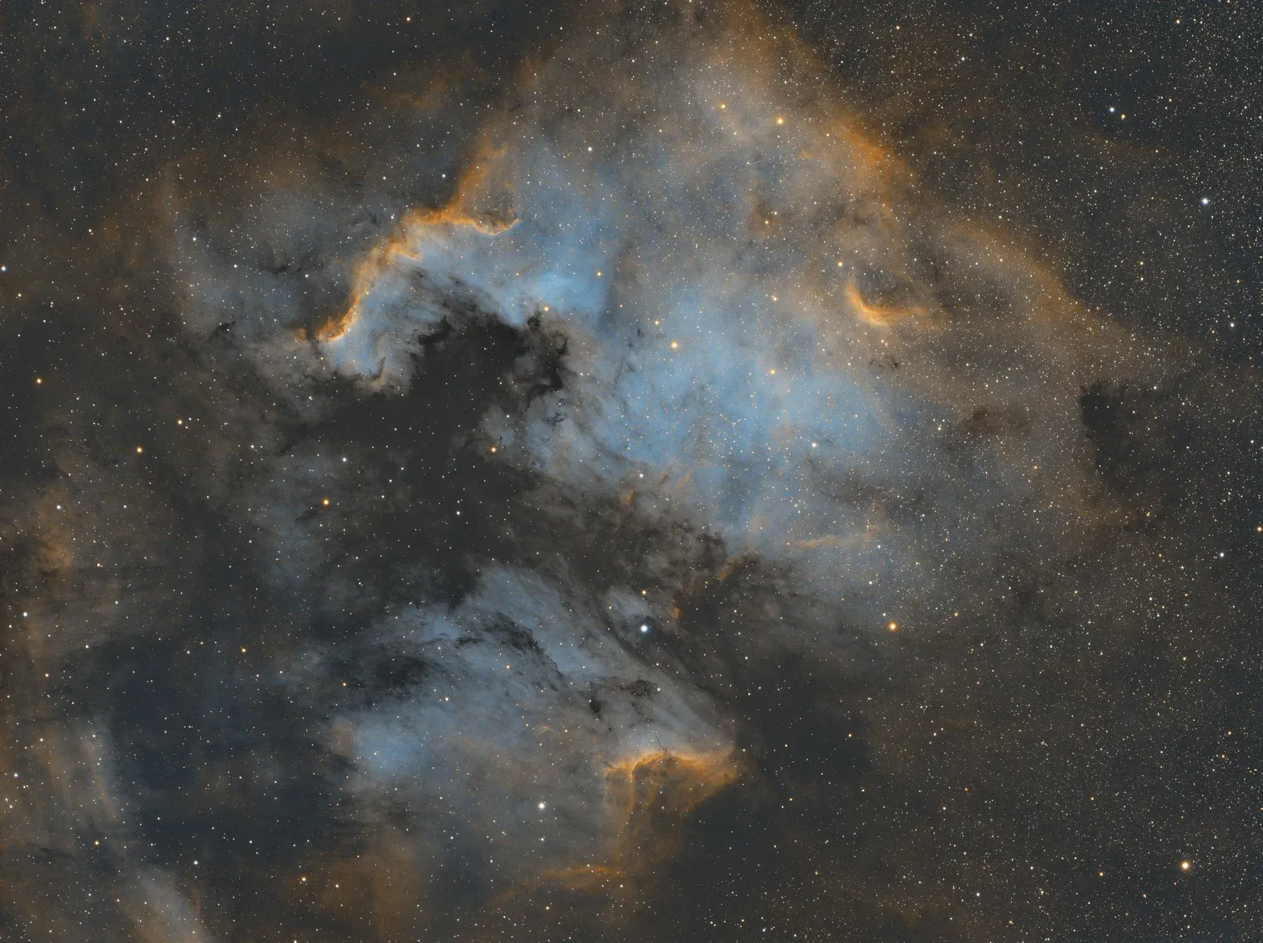  This is the North American Nebula (NGC 7000) along with the Pelican Nebula (IC1050). I captured this over 4-5 nights for a total of about 16 hours. It’s All narrowband, Hydrogen Alpha, Oxygen III, and Nitrogen II. 
